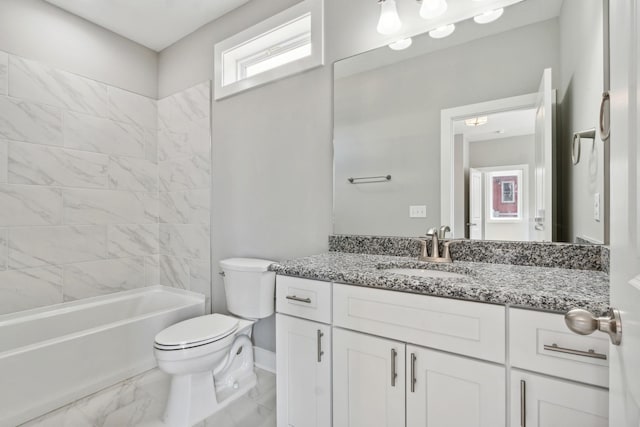 full bath with baseboards, toilet, marble finish floor, vanity, and shower / bathing tub combination