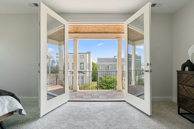 entryway featuring carpet flooring and french doors