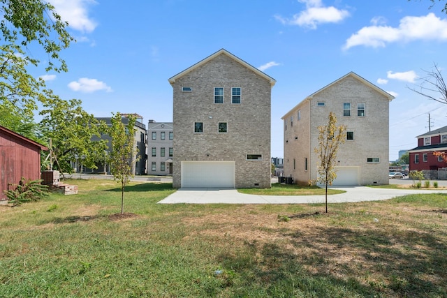 rear view of house with driveway, a garage, central AC unit, and a lawn