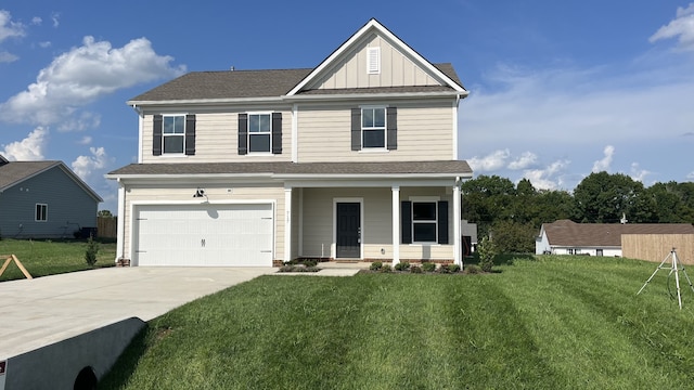 view of front of house featuring a garage and a front lawn