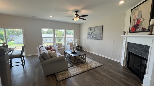 living room with dark hardwood / wood-style floors and plenty of natural light