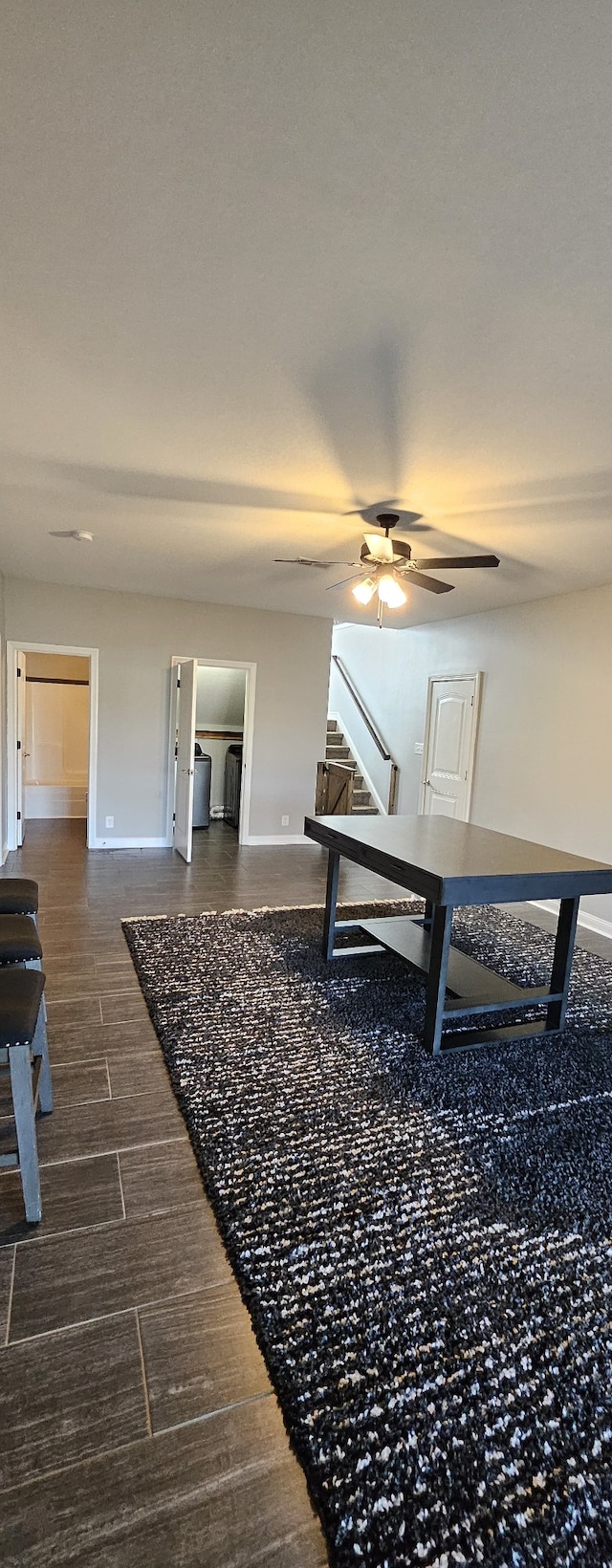 interior space featuring ceiling fan