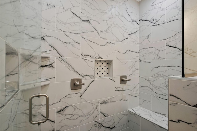 details featuring tiled shower