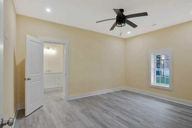 spare room with light wood-style flooring, baseboards, ceiling fan, and recessed lighting