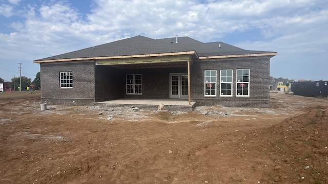 back of house with a patio