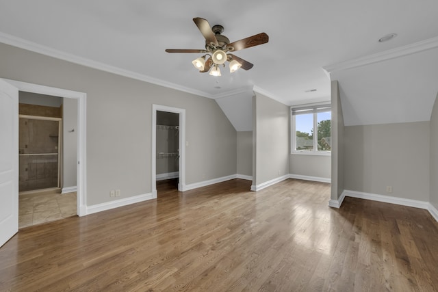 additional living space with lofted ceiling, wood-type flooring, and ceiling fan