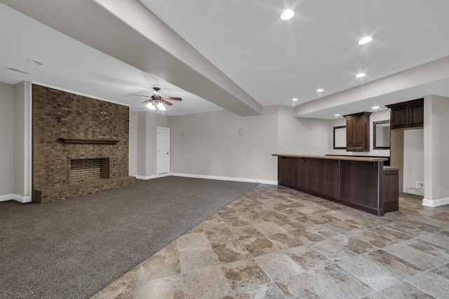 unfurnished living room with light colored carpet, ceiling fan, and a brick fireplace