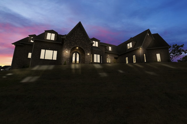 french provincial home featuring driveway