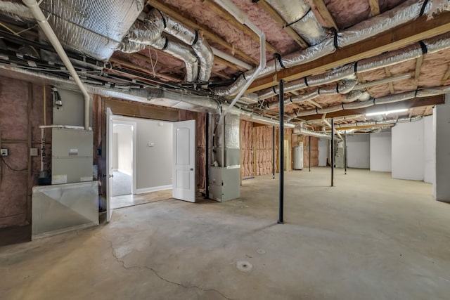 basement with heating unit and water heater