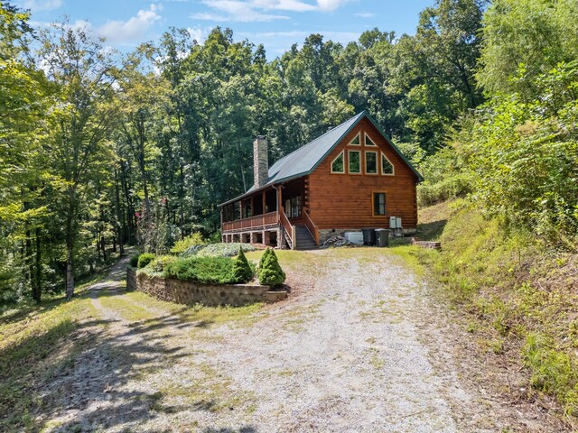 log home with covered porch