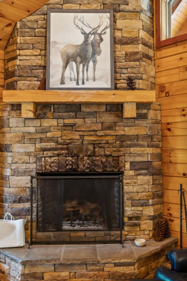 details with a stone fireplace