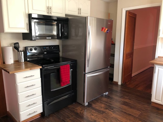 kitchen with butcher block countertops, appliances with stainless steel finishes, dark hardwood / wood-style flooring, and white cabinets