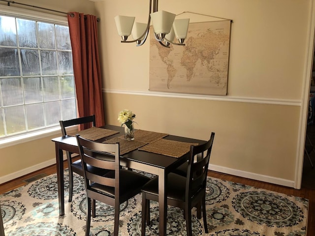 dining area with a healthy amount of sunlight and wood-type flooring