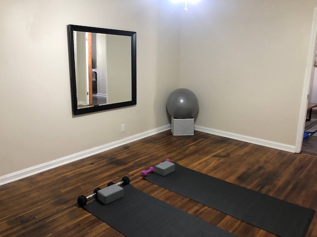 workout area with hardwood / wood-style floors