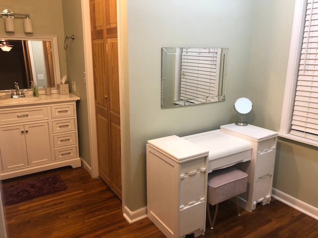 bathroom with hardwood / wood-style floors and vanity