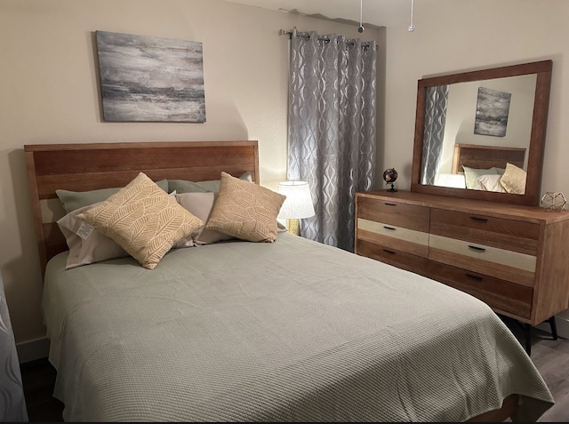 bedroom featuring hardwood / wood-style floors