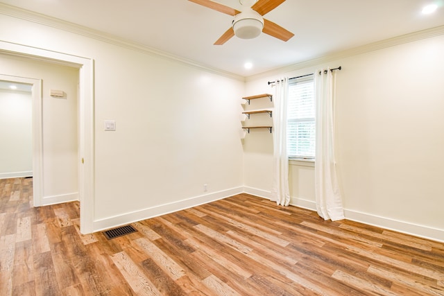 unfurnished room with light hardwood / wood-style flooring, ceiling fan, and ornamental molding