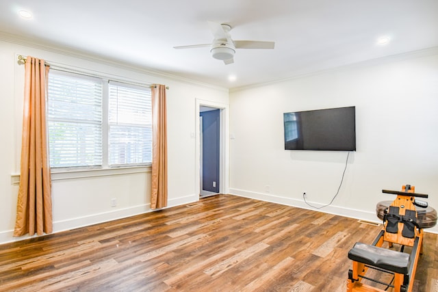 interior space featuring hardwood / wood-style floors, crown molding, and ceiling fan