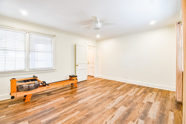 spare room with ceiling fan, light hardwood / wood-style floors, and ornamental molding