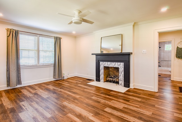 unfurnished living room with ceiling fan, ornamental molding, and hardwood / wood-style flooring