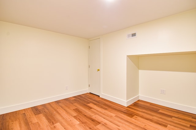 empty room with light hardwood / wood-style floors