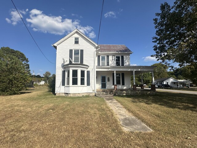 view of front of house featuring a porch and a front lawn