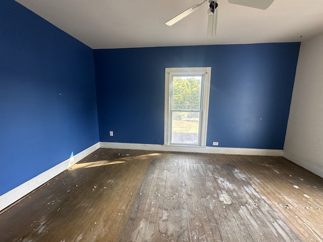 unfurnished room with ceiling fan and hardwood / wood-style flooring