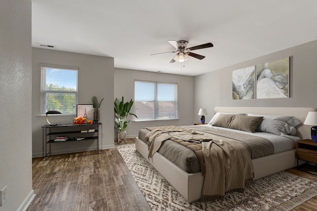 bedroom with dark wood-type flooring and ceiling fan