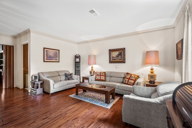 living room with dark hardwood / wood-style flooring and ornamental molding