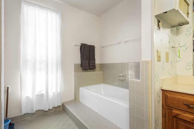 bathroom with tile patterned floors, plenty of natural light, and vanity