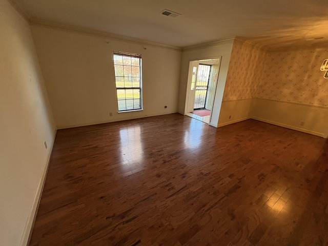 unfurnished room featuring crown molding and dark hardwood / wood-style floors