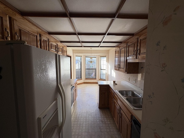 kitchen with dishwasher, white refrigerator with ice dispenser, and sink