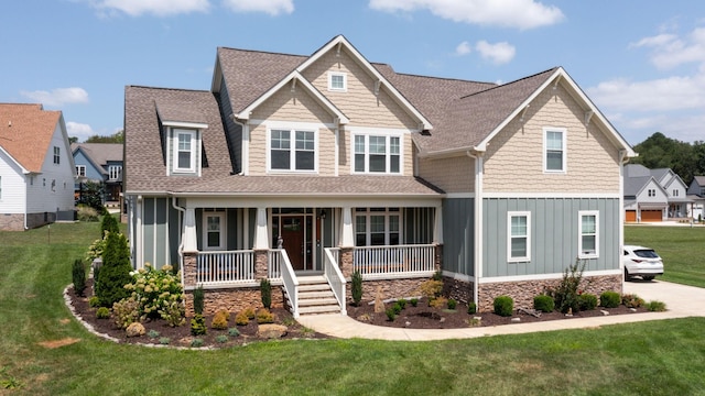 craftsman inspired home featuring board and batten siding, a shingled roof, central air condition unit, a front yard, and covered porch