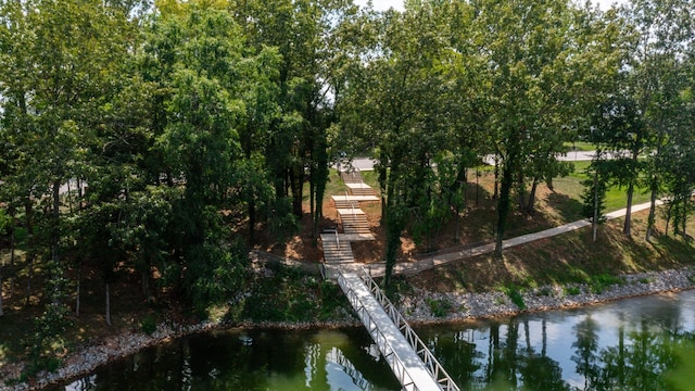 exterior space featuring stairs and a water view