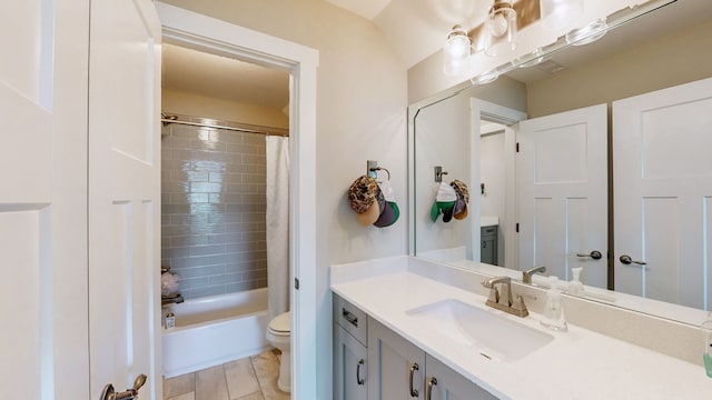 full bathroom featuring toilet, shower / bath combo with shower curtain, and vanity