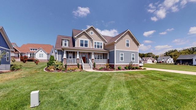 craftsman-style house featuring a porch, board and batten siding, and a front lawn