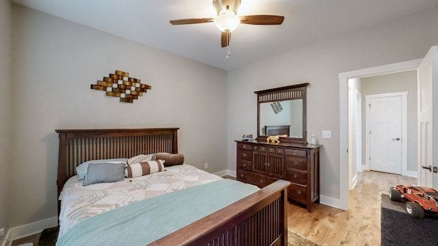 bedroom featuring light hardwood / wood-style floors and ceiling fan