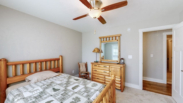 bedroom with light hardwood / wood-style floors and ceiling fan