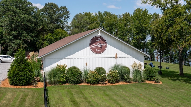 view of outbuilding with a yard