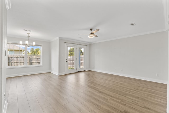 empty room featuring light hardwood / wood-style flooring, ornamental molding, and ceiling fan with notable chandelier