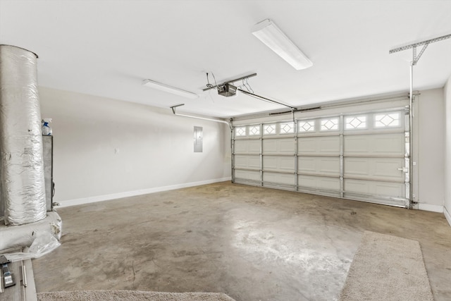 garage with electric panel and a garage door opener