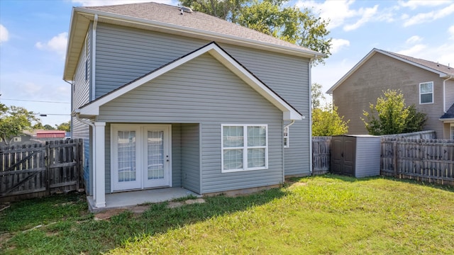 back of property featuring a yard