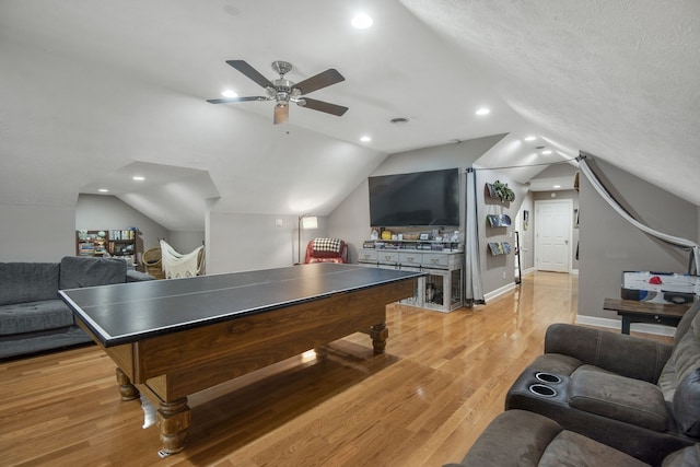 playroom featuring light hardwood / wood-style floors, lofted ceiling, a textured ceiling, and ceiling fan