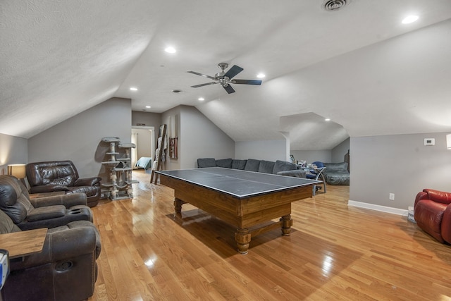 rec room featuring ceiling fan, a textured ceiling, light hardwood / wood-style floors, and lofted ceiling