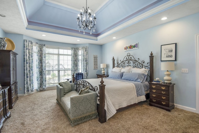 bedroom featuring a notable chandelier, carpet floors, and a tray ceiling