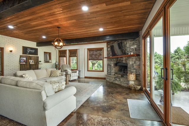 living room with a fireplace, an inviting chandelier, wooden ceiling, and brick wall