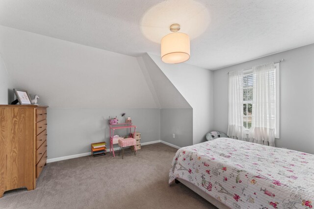 carpeted bedroom featuring vaulted ceiling and a textured ceiling