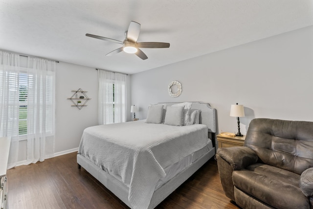 bedroom featuring ceiling fan and dark hardwood / wood-style floors