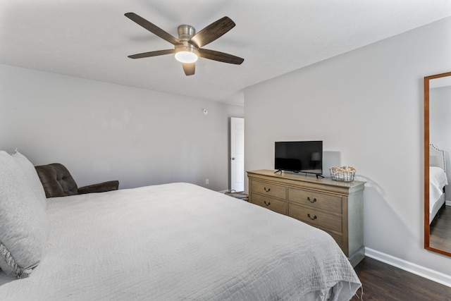 bedroom featuring dark wood-style floors, ceiling fan, and baseboards