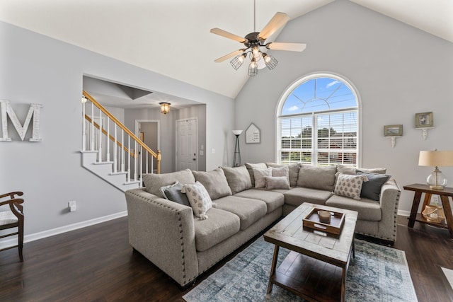 living room with ceiling fan, dark hardwood / wood-style floors, and high vaulted ceiling